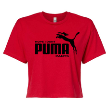 Load image into Gallery viewer, A red short-sleeve crop top t-shirt featuring a black graphic print on the front with the text 'HOPE I DONT PUMA PANTS' and a black leaping cat silhouette, displayed on a solid white background.
